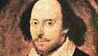 Porträt eines Mannes mit lockigem, schwarzem Haar und einem leichten Bart. Er trägt ein schwarzes Oberteil und einen weißen Kragen. Sein Blick ist ernst, und er scheint direkt in die Kamera zu schauen. Das Bild vermittelt eine historische Atmosphäre. Es soll William Shakespeare darstellen. 